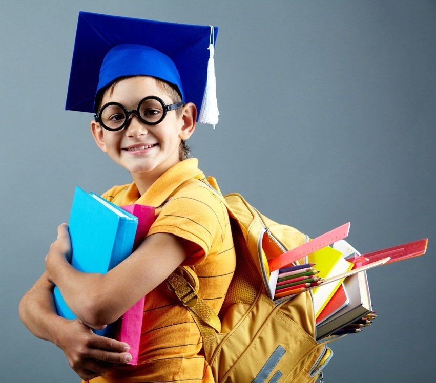 A young graduate with books and a backpack